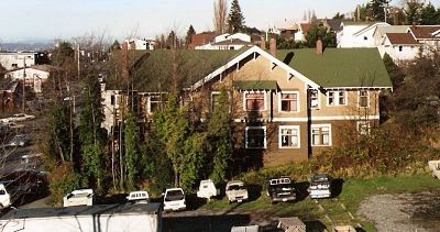 Cars parked on empty lot that is now Fairhaven Gardens